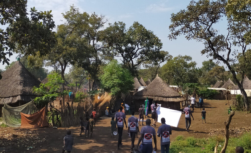 Advocates from Gambella walk around a town.