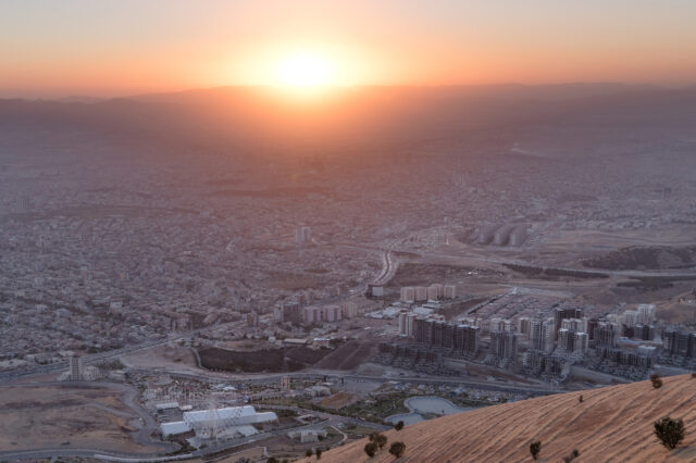 A sunset over a city skyline.