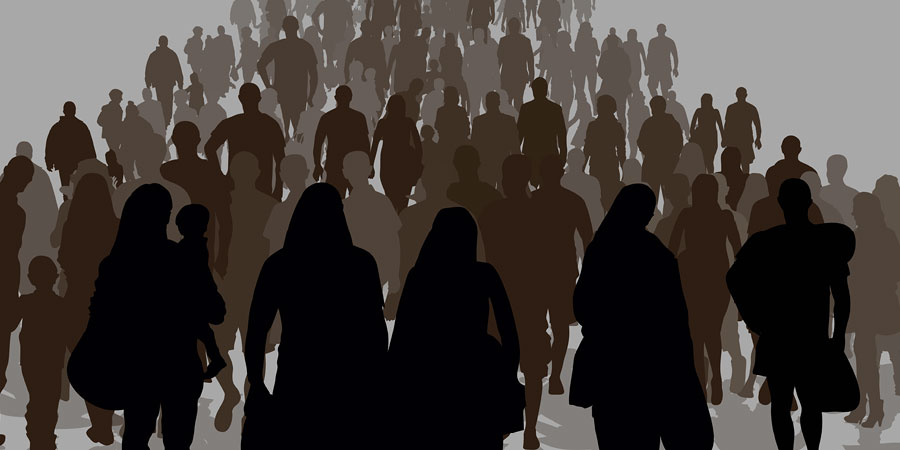 Several silhouettes of people coming together to form a crowd.