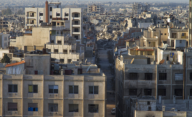 A partially destroyed city skyline.