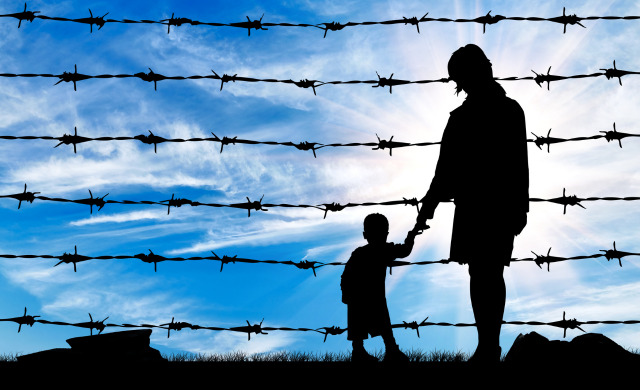 Horizontal lines of barbed wire overlap with silhouettes of a mother and child, a blue sky behind them.