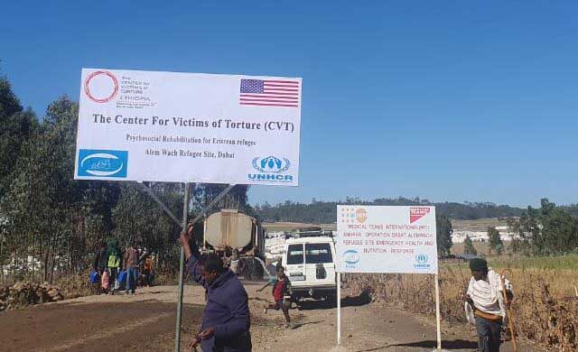 A sign that reads: "The Center For Victims of Torture (CVT) Psychosocial Rehabilitation for Eritrean Refugees Alem Wach Refugee Site Dabat"